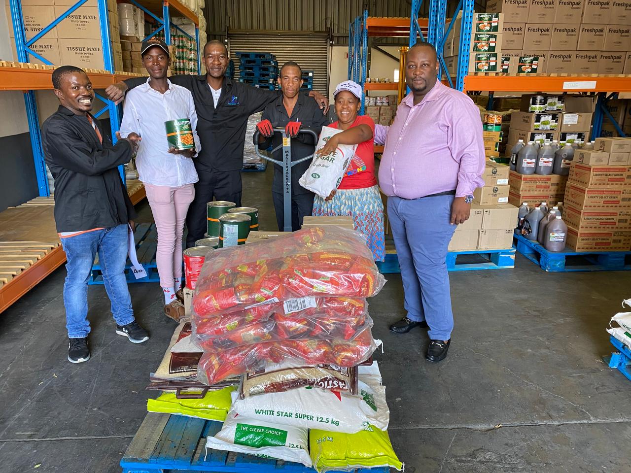 Foundation team distributing food supplies from a warehouse