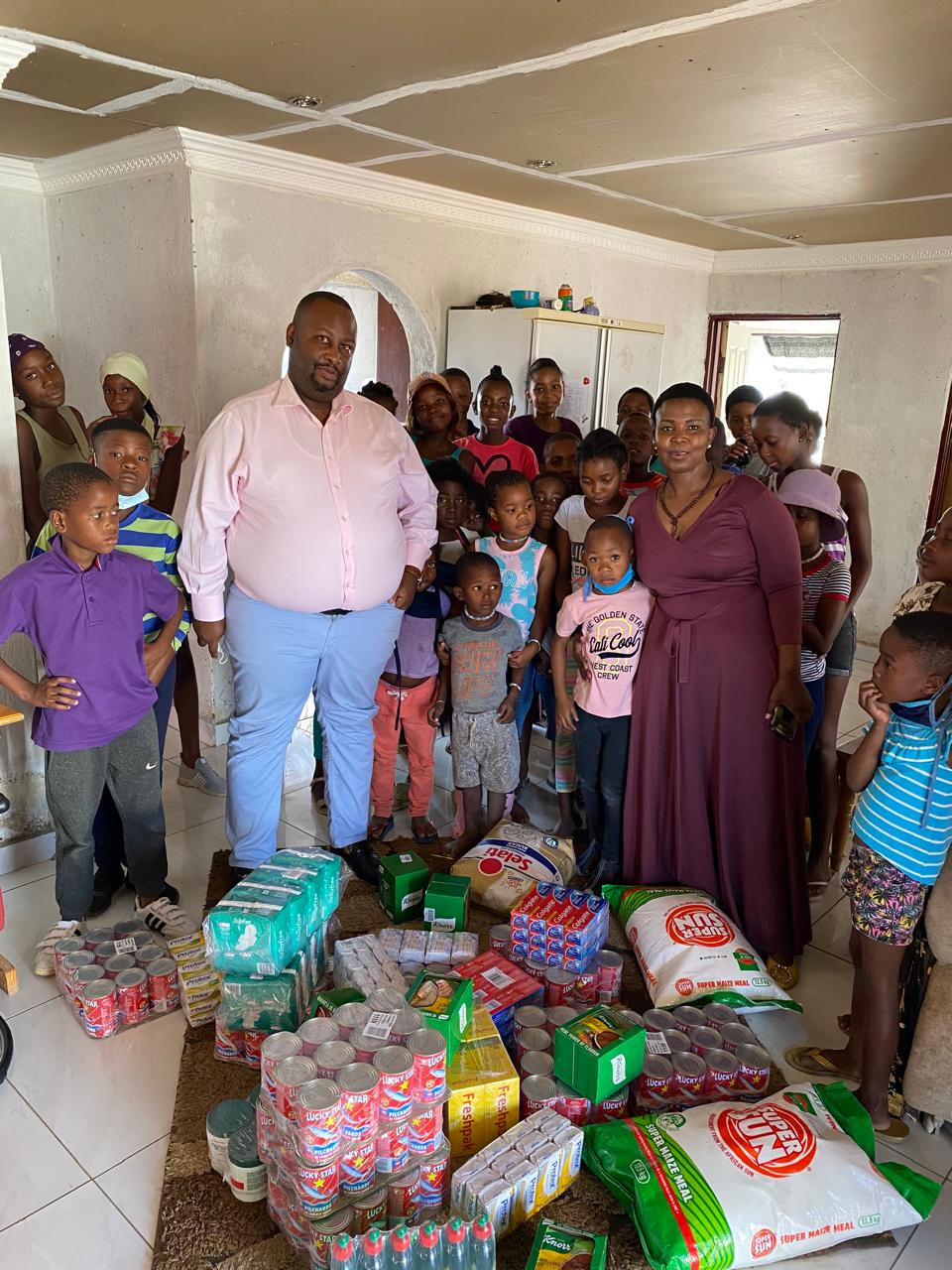 John Manaswe delivering essentials to a children's home
